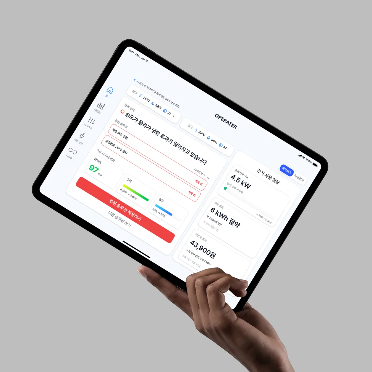 Operator &mdash; the HVAC dashboard on a tablet, held in one hand